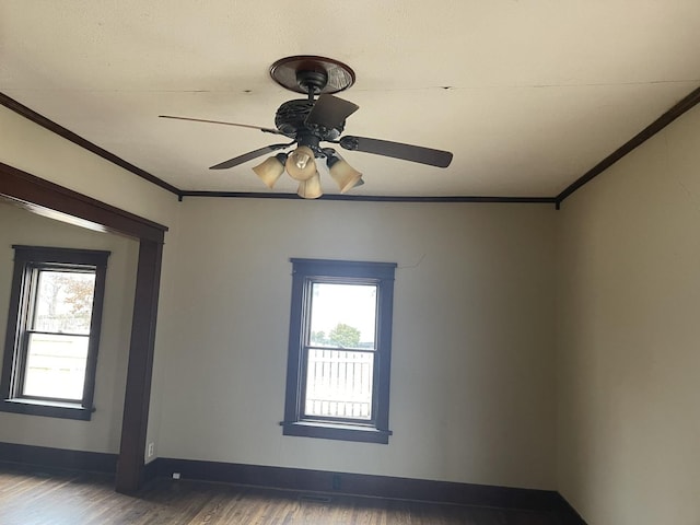 622 Clark St, Marseilles, IL 61341 - unfurnished room featuring wood finished floors, ornamental molding, ceiling fan, and baseboards