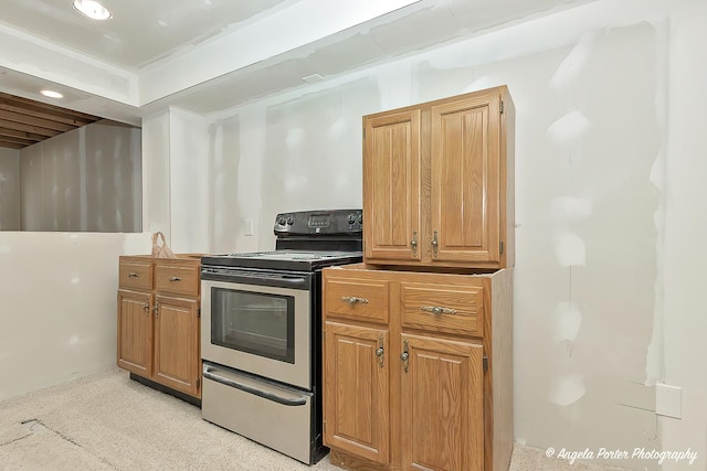 12401 Bigelow Ave, Hebron, IL 60034 - kitchen featuring stainless steel range with electric cooktop, brown cabinetry, and recessed lighting