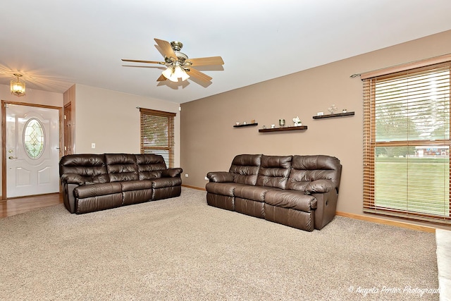 12401 Bigelow Ave, Hebron, IL 60034 - carpeted living room with a ceiling fan and baseboards