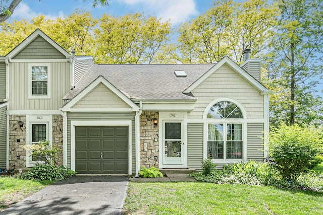 1911 Ozark Pkwy, Algonquin, IL 60102 - view of front of home featuring stone siding, asphalt driveway, a shingled roof, a chimney, and a garage
