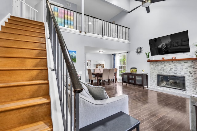 1911 Ozark Pkwy, Algonquin, IL 60102 - living area with a high ceiling, ceiling fan, wood finished floors, stairway, and a tile fireplace
