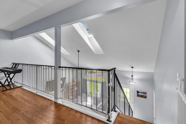 1911 Ozark Pkwy, Algonquin, IL 60102 - hall featuring a skylight, wood finished floors, vaulted ceiling, and an upstairs landing