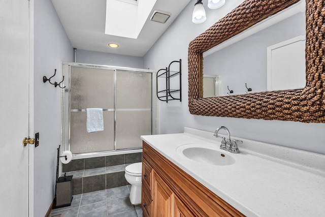 1911 Ozark Pkwy, Algonquin, IL 60102 - full bath featuring a skylight, a shower with door, vanity, toilet, and tile patterned floors