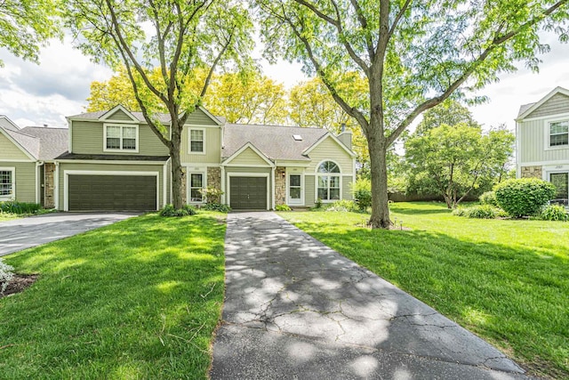 1911 Ozark Pkwy, Algonquin, IL 60102 - view of front of home with stone siding, asphalt driveway, and a front lawn