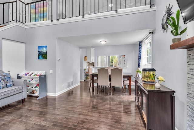 1911 Ozark Pkwy, Algonquin, IL 60102 - dining room featuring a high ceiling, wood finished floors, and baseboards
