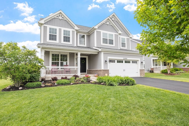 12414 Dublin Ln, Plainfield, IL 60585 - craftsman inspired home featuring a porch, board and batten siding, driveway, an attached garage, and a front lawn