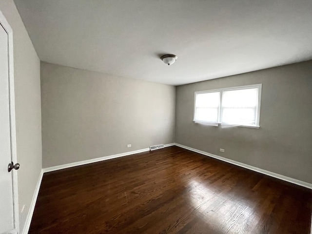 3914 153rd St, Midlothian, IL 60445 - spare room featuring dark wood-type flooring and baseboards