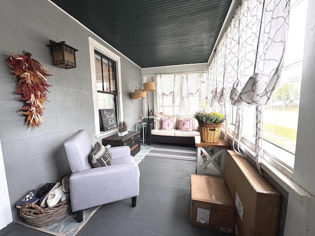 1118 W 4th St, Dixon, IL 61021 - sunroom / solarium featuring healthy amount of natural light, hardwood / wood-style floors, and concrete block wall