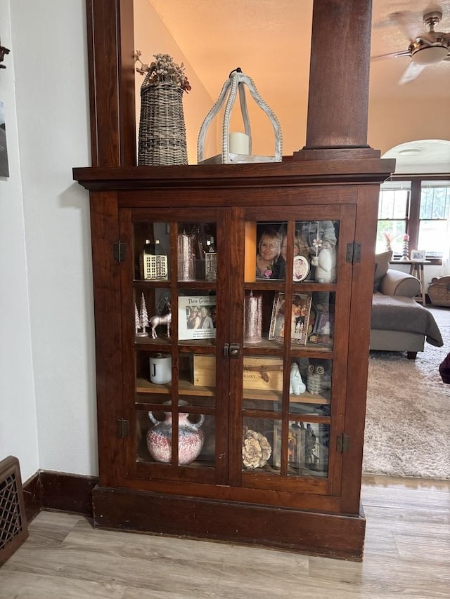 1118 W 4th St, Dixon, IL 61021 - detailed view of arched walkways, wood finished floors, and ceiling fan
