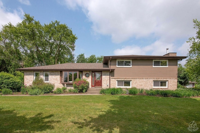 28671 Moose Range Rd, Sycamore, IL 60178 - split level home with a front lawn, a chimney, and brick siding