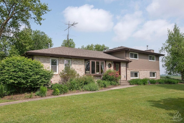 28671 Moose Range Rd, Sycamore, IL 60178 - split level home with brick siding, a front yard, and a chimney