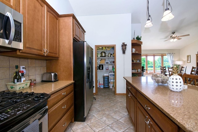 28671 Moose Range Rd, Sycamore, IL 60178 - kitchen with stainless steel appliances, backsplash, brown cabinetry, light stone countertops, and ceiling fan