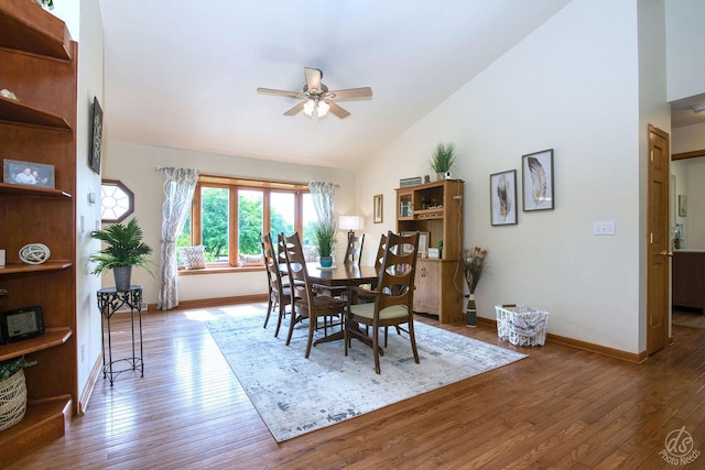 28671 Moose Range Rd, Sycamore, IL 60178 - dining area featuring ceiling fan, baseboards, hardwood / wood-style floors, and high vaulted ceiling