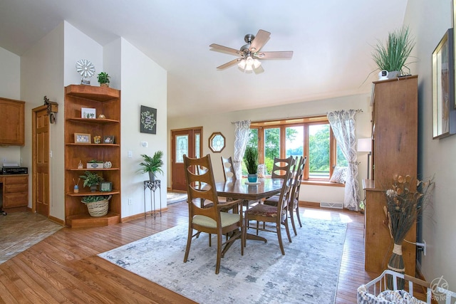28671 Moose Range Rd, Sycamore, IL 60178 - dining room with high vaulted ceiling, ceiling fan, light wood-style floors, and baseboards