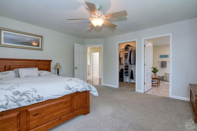 28671 Moose Range Rd, Sycamore, IL 60178 - bedroom featuring a walk in closet, light carpet, a closet, baseboards, and ensuite bathroom