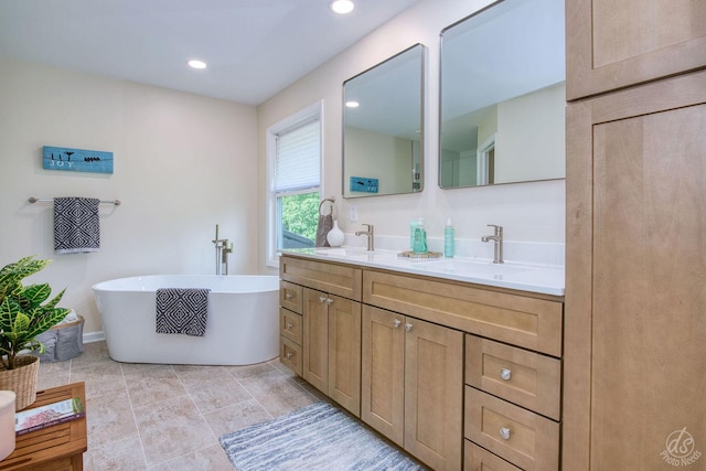 28671 Moose Range Rd, Sycamore, IL 60178 - full bathroom featuring double vanity, a freestanding bath, baseboards, and recessed lighting