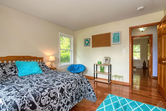 28671 Moose Range Rd, Sycamore, IL 60178 - bedroom featuring wood finished floors, multiple windows, and baseboards