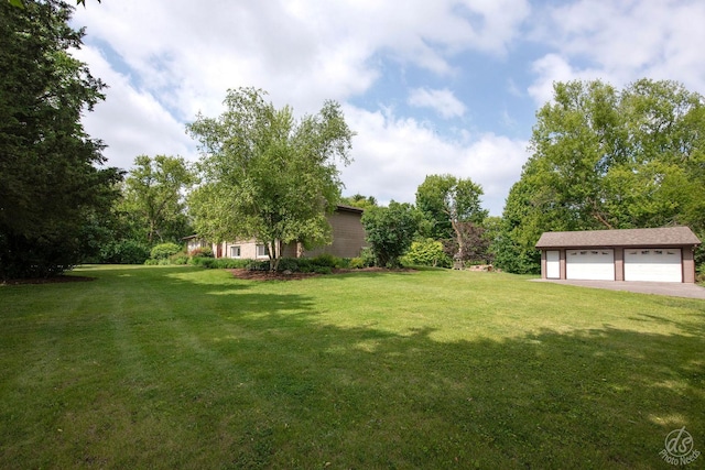 28671 Moose Range Rd, Sycamore, IL 60178 - view of green lawn featuring a garage and an outbuilding