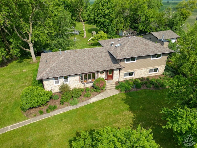 28671 Moose Range Rd, Sycamore, IL 60178 - view of front facade featuring a front yard, roof with shingles, and stone siding