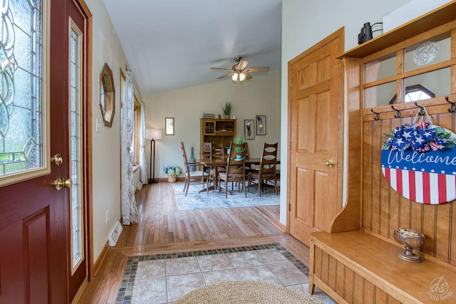 28671 Moose Range Rd, Sycamore, IL 60178 - entrance foyer with vaulted ceiling, ceiling fan, light wood finished floors, and baseboards