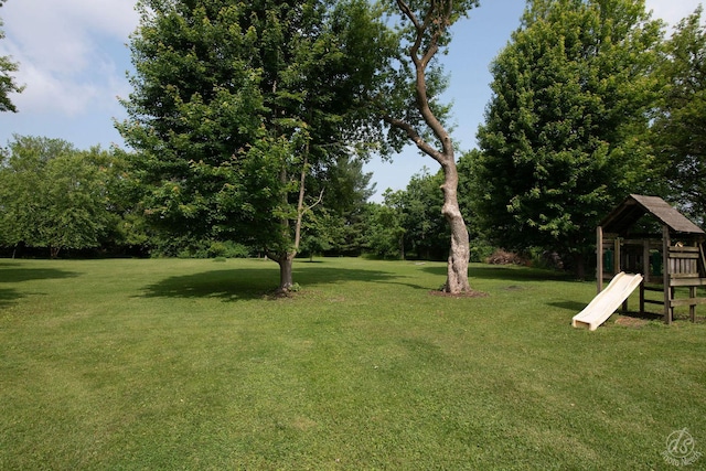 28671 Moose Range Rd, Sycamore, IL 60178 - view of green lawn with a playground and view of scattered trees