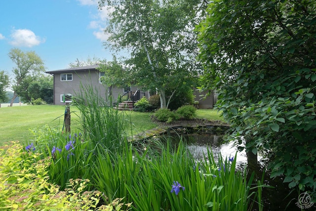 28671 Moose Range Rd, Sycamore, IL 60178 - view of grassy yard with a garden pond