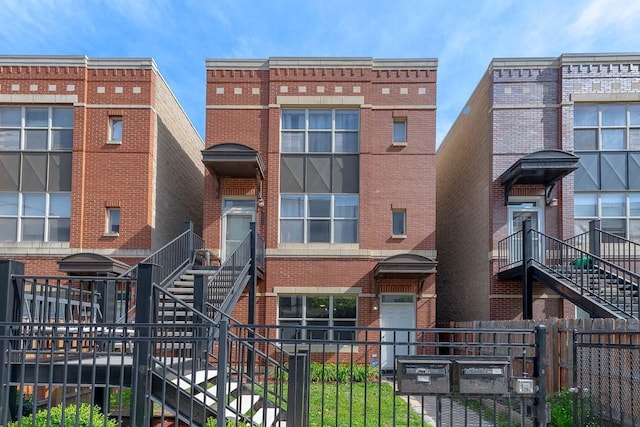 2142 W Madison St Unit 1, Chicago, IL 60612 - view of front of home featuring stairs and brick siding