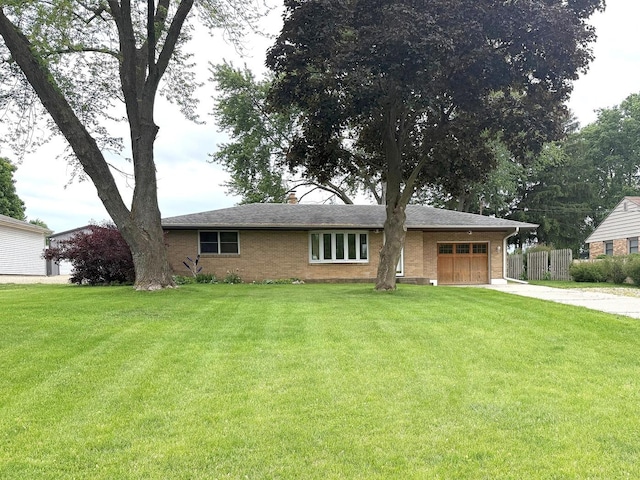 1417 S College Ave, Dixon, IL 61021 - ranch-style home featuring an attached garage, concrete driveway, and brick siding