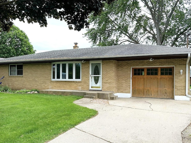 1417 S College Ave, Dixon, IL 61021 - ranch-style home with brick siding, an attached garage, driveway, and a front yard