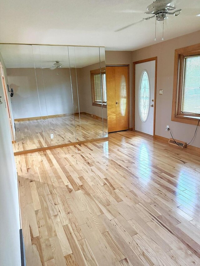 1417 S College Ave, Dixon, IL 61021 - foyer entrance with a ceiling fan, wood finished floors, plenty of natural light, and baseboards