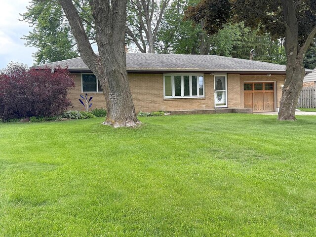 1417 S College Ave, Dixon, IL 61021 - single story home with brick siding, roof with shingles, and an attached garage