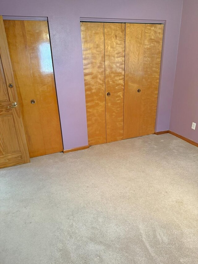 1417 S College Ave, Dixon, IL 61021 - unfurnished bedroom featuring carpet and baseboards