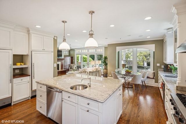 548 Cherry St, Winnetka, IL 60093 - kitchen featuring stainless steel dishwasher, a sink, white cabinets, dark wood finished floors, and ornamental molding