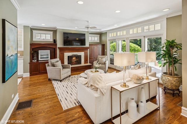 548 Cherry St, Winnetka, IL 60093 - living area with ornamental molding, a lit fireplace, ceiling fan, recessed lighting, and baseboards