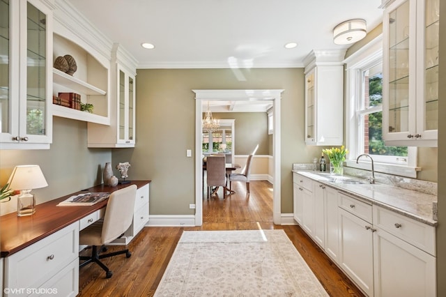 548 Cherry St, Winnetka, IL 60093 - home office with dark wood-style floors, a sink, built in study area, crown molding, and baseboards