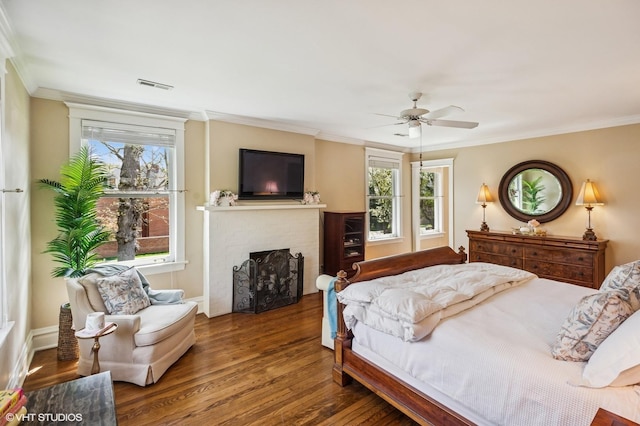 548 Cherry St, Winnetka, IL 60093 - bedroom featuring ornamental molding, wood finished floors, multiple windows, a brick fireplace, and ceiling fan
