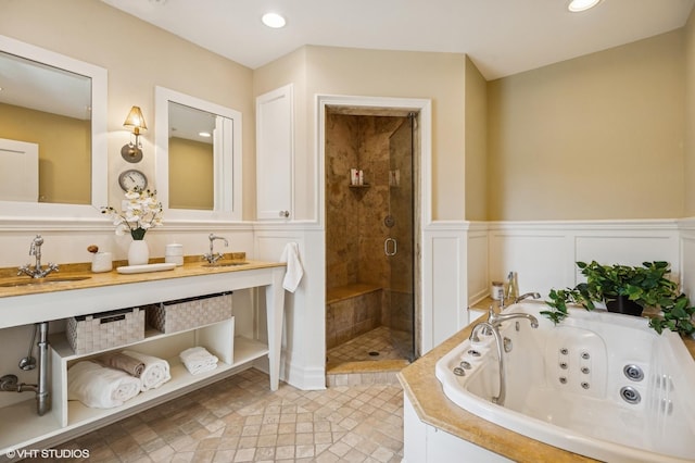 548 Cherry St, Winnetka, IL 60093 - full bathroom with a shower stall, a tub with jets, double vanity, wainscoting, and recessed lighting