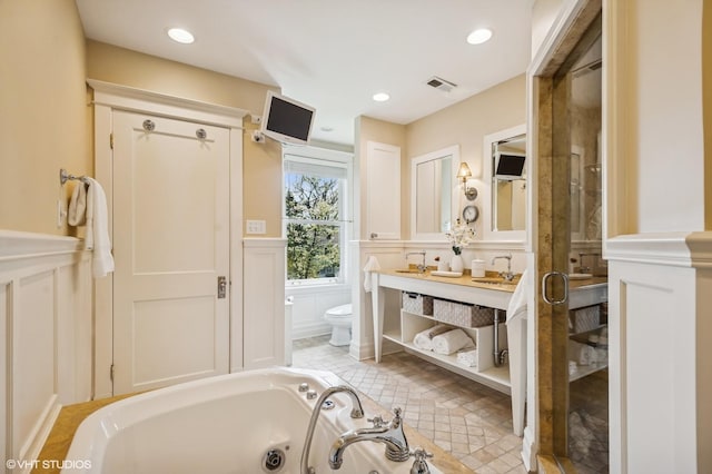 548 Cherry St, Winnetka, IL 60093 - bathroom with a decorative wall, toilet, a shower stall, double vanity, and a tub with jets