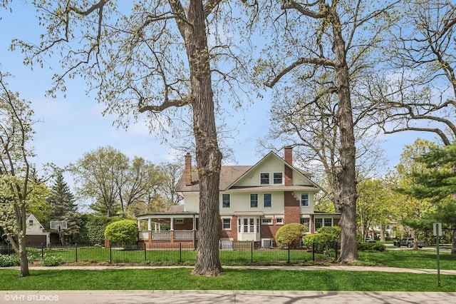 548 Cherry St, Winnetka, IL 60093 - view of front of home with a chimney, brick siding, and central AC