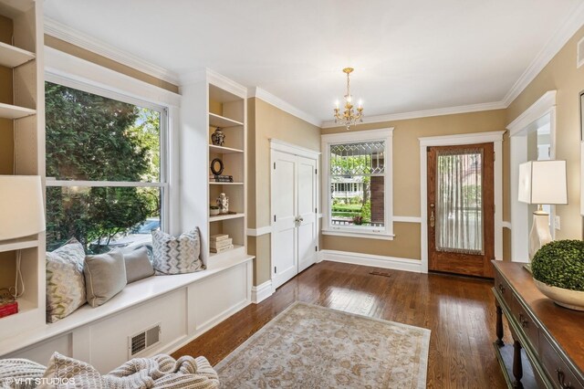 548 Cherry St, Winnetka, IL 60093 - entrance foyer featuring a chandelier, wood finished floors, plenty of natural light, and crown molding