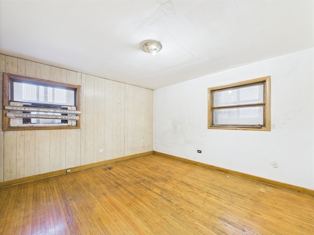 9216 S Ada St, Chicago, IL 60620 - unfurnished room featuring wood-type flooring, wood walls, and baseboards