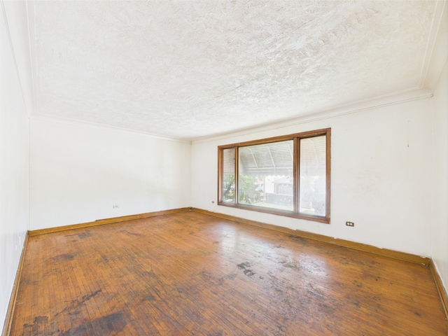 9216 S Ada St, Chicago, IL 60620 - empty room featuring a textured ceiling, wood-type flooring, crown molding, and baseboards