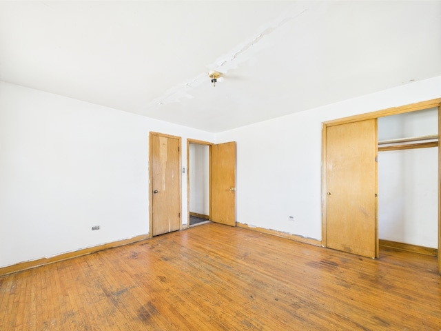 9216 S Ada St, Chicago, IL 60620 - unfurnished bedroom featuring light wood-style floors and baseboards