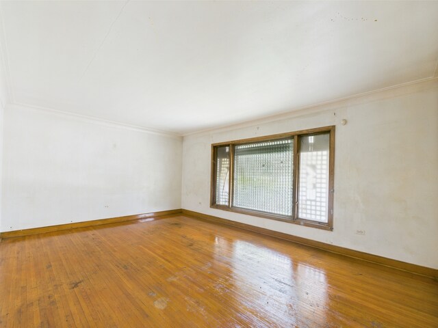 9216 S Ada St, Chicago, IL 60620 - spare room featuring ornamental molding, hardwood / wood-style floors, and baseboards