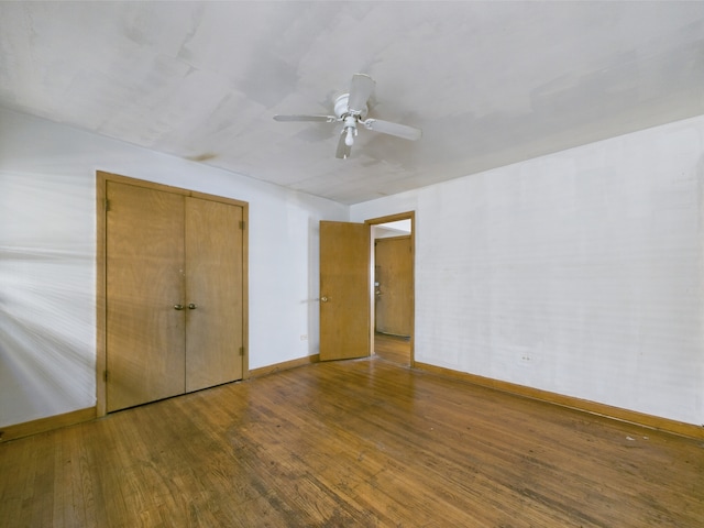 9216 S Ada St, Chicago, IL 60620 - unfurnished bedroom with wood-type flooring, baseboards, ceiling fan, and a closet