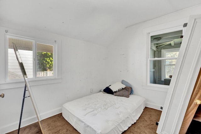 1917 Emerson St, Evanston, IL 60201 - carpeted bedroom featuring lofted ceiling and baseboards