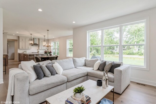 6030 Fairview Ave, Downers Grove, IL 60516 - living area with a chandelier, recessed lighting, and light wood-type flooring