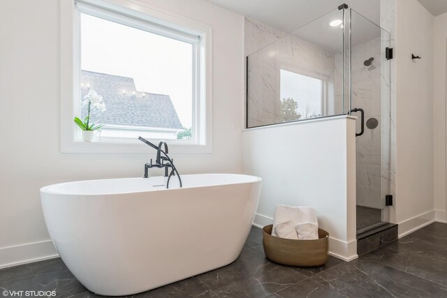 6030 Fairview Ave, Downers Grove, IL 60516 - bathroom with marble tiled floors, a freestanding bath, and a stall shower