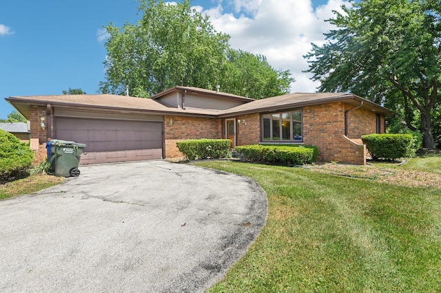 71 Ruggles Ct, Orland Park, IL 60467 - view of front facade featuring driveway, brick siding, a front yard, and an attached garage