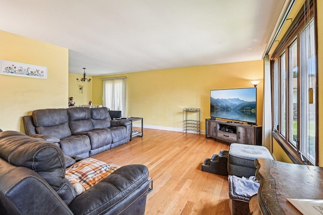 71 Ruggles Ct, Orland Park, IL 60467 - living area featuring plenty of natural light, wood finished floors, and a chandelier